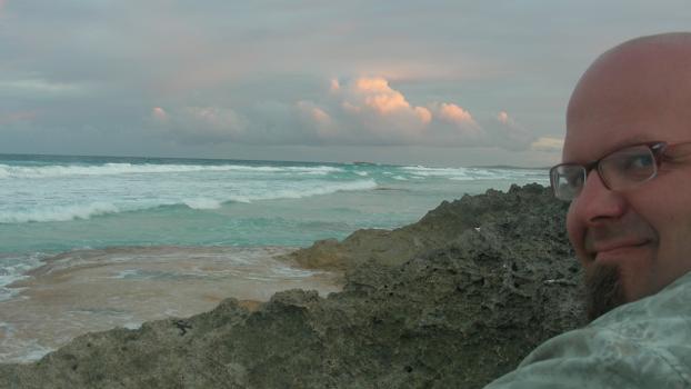 Waiting for the sunset after planting the coconut